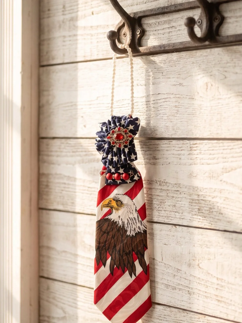 Patriotic Eagle necktie necklace Red, White & Blue adorned with a red brooch